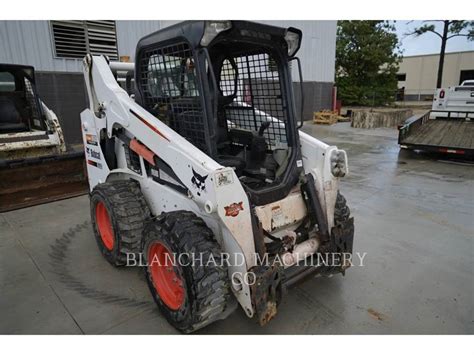 blue book bobcat skid steer|bobcat s590 value.